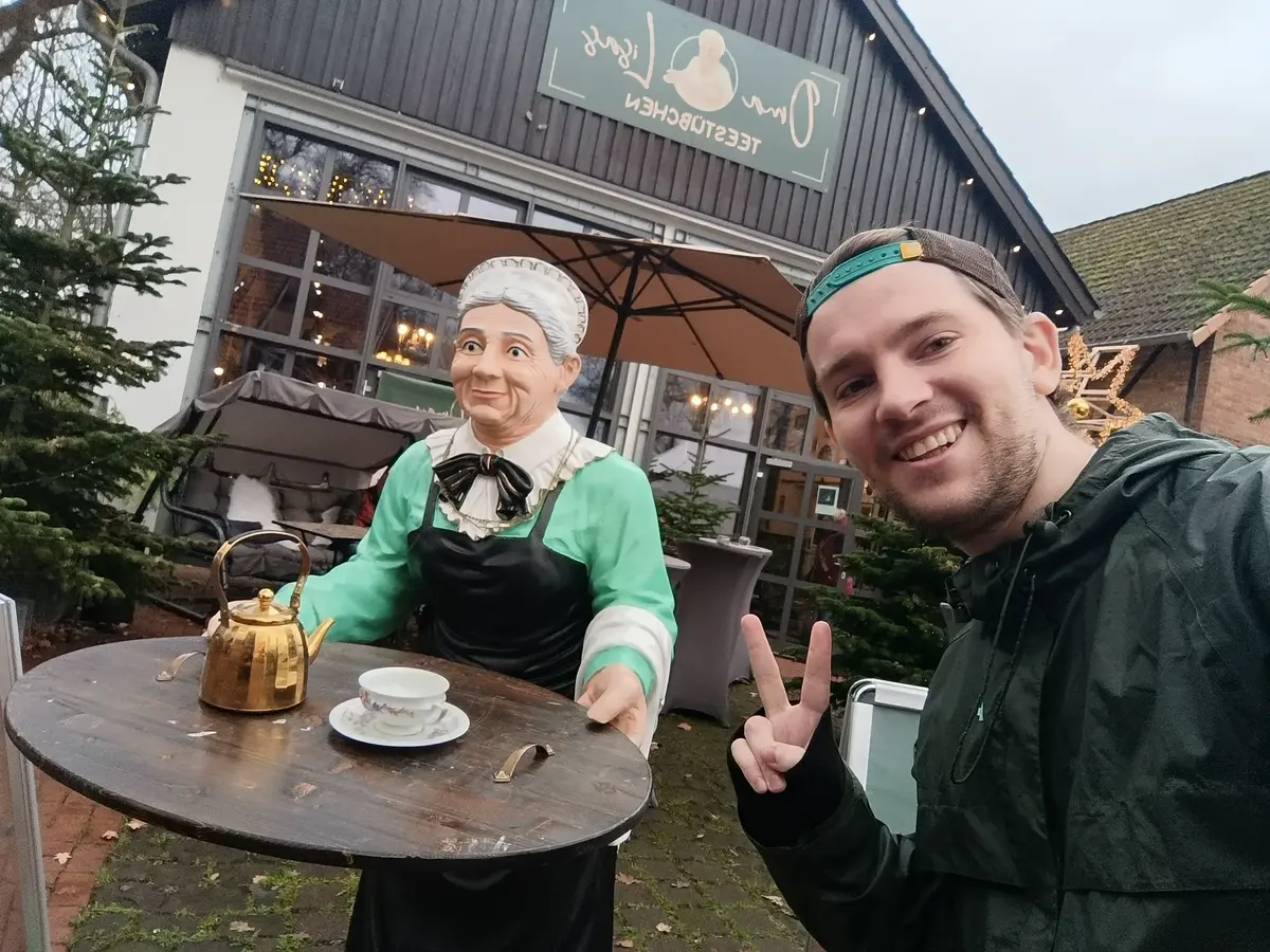 Two people meeting at a café during project outreach